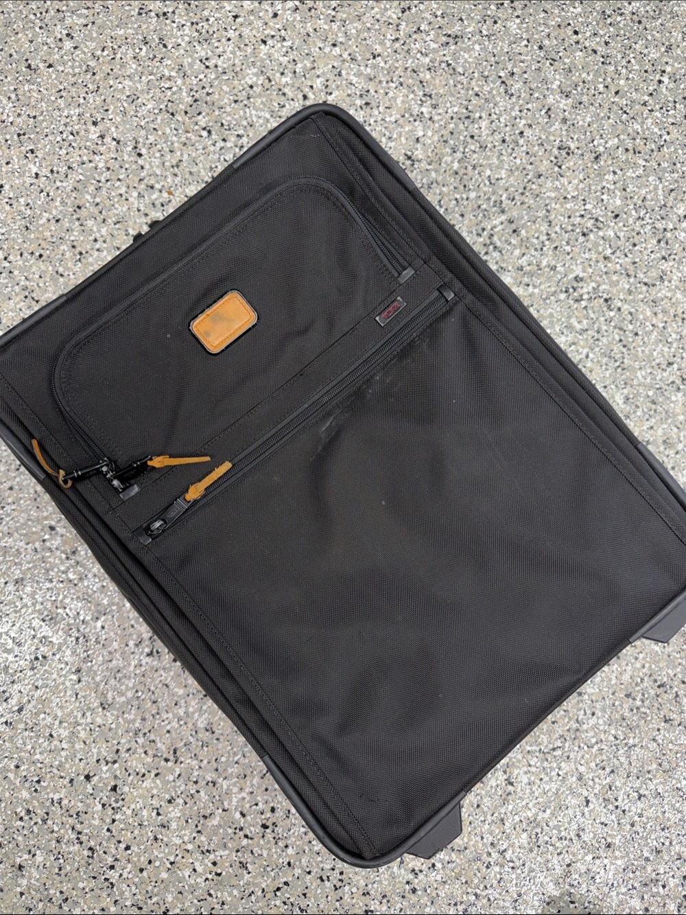 Tumi Black Carry-On with Brown Leather Accents